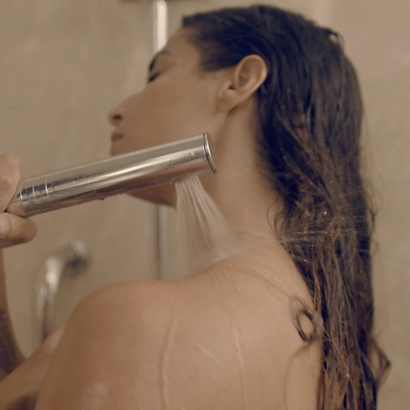 Altered design shower head to save water in the home