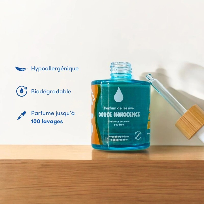 Parfum concentré Ops Clean Douce Innocence: flacon bleu translucide avec bouchon, affichant hypoallergénique et biodégradable, t